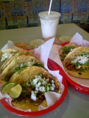 Chela's tacos and horchata and our piles or hot sauces and salsas